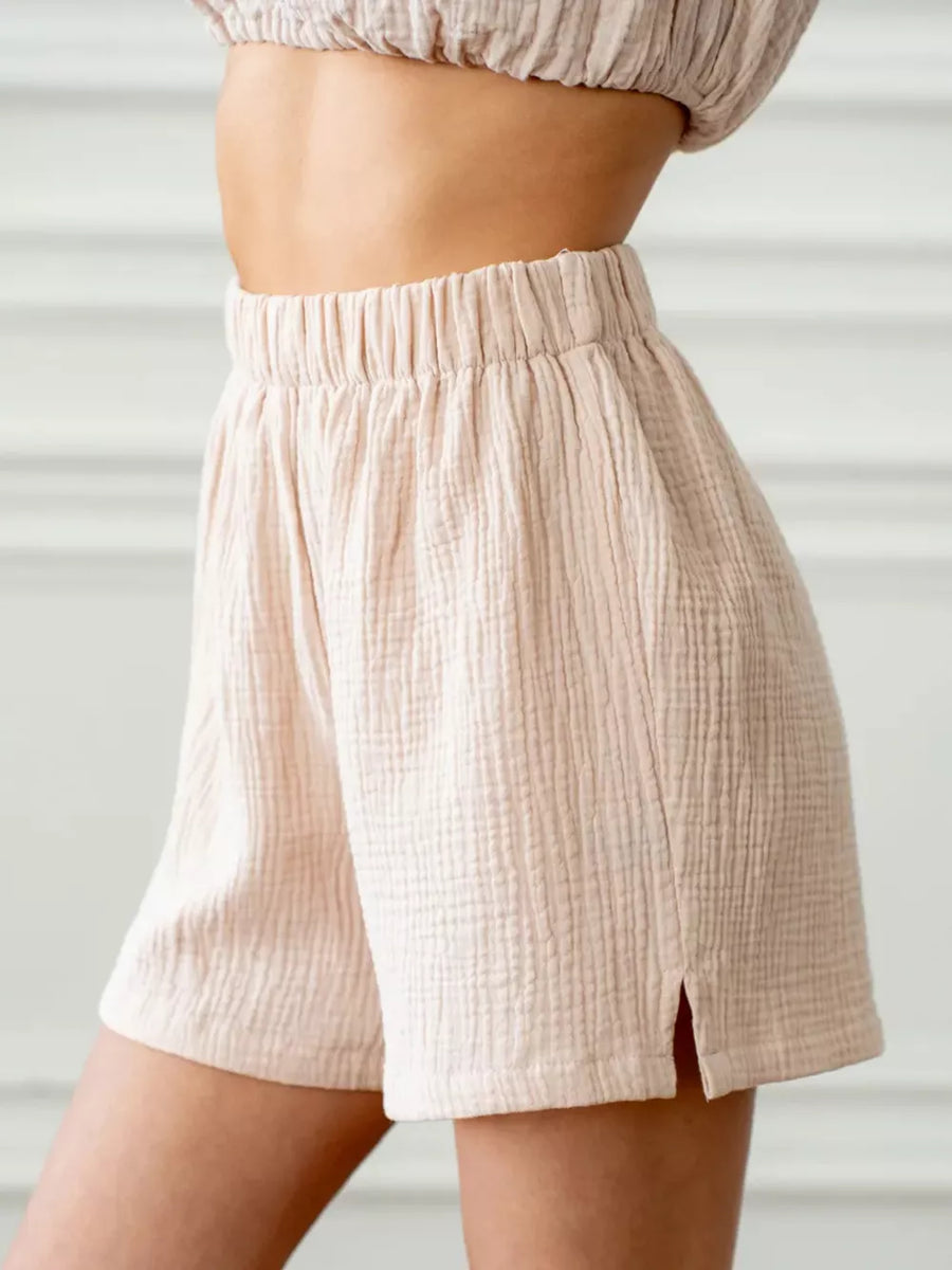 Khaki cotton gauze shorts with elastic waist and side slits, part of a set.