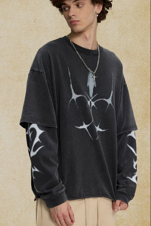Black distressed graphic tee with layered sleeves and abstract white print.