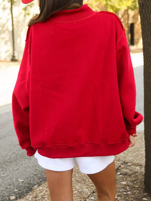red oversized sweatshirt with mock neck