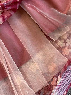 Lace-embellished sweetheart maxi dress in pink with floral print and tulle overlay.