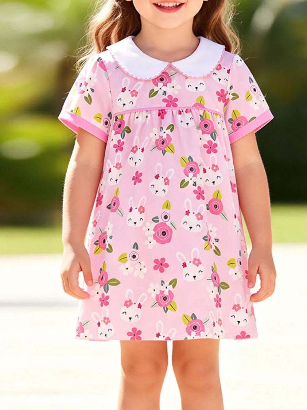 Pink cotton toddler dress with bunny and floral print, Peter Pan collar.