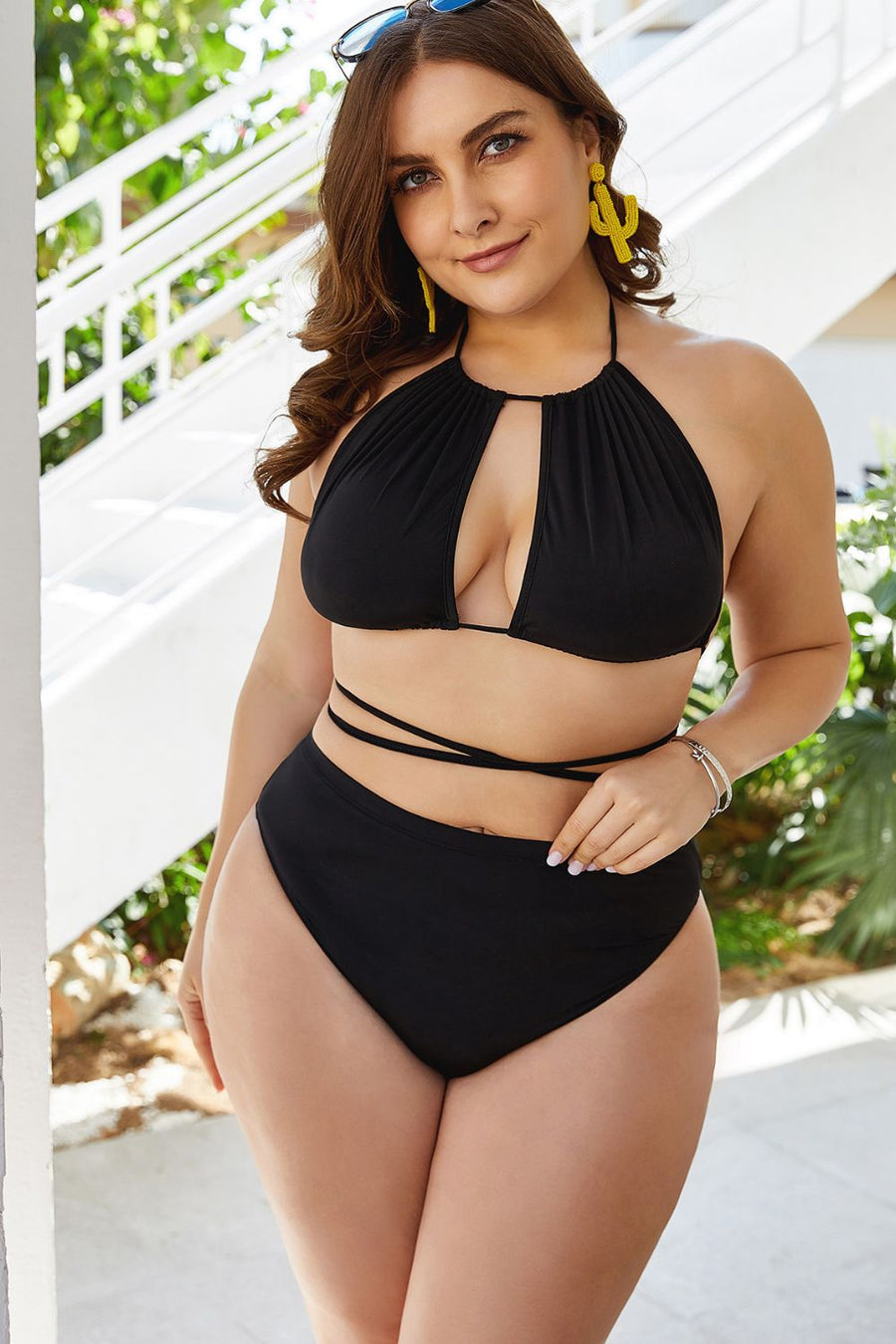 Black halter bikini with keyhole cutout top and high-waist bottoms with tie detail