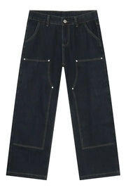 Dark wash denim carpenter pants with a wide, relaxed fit and contrast stitching.