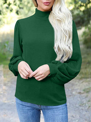 Dark green mock neck top with puff sleeves and button back detail