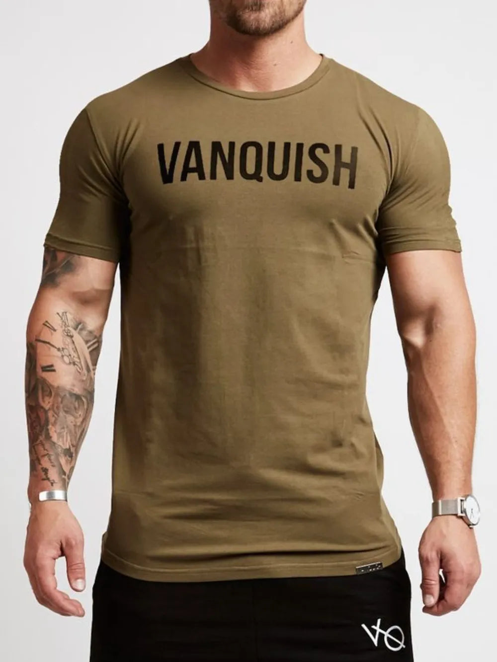 Olive crew neck t-shirt with black VANQUISH graphic and short sleeves.
