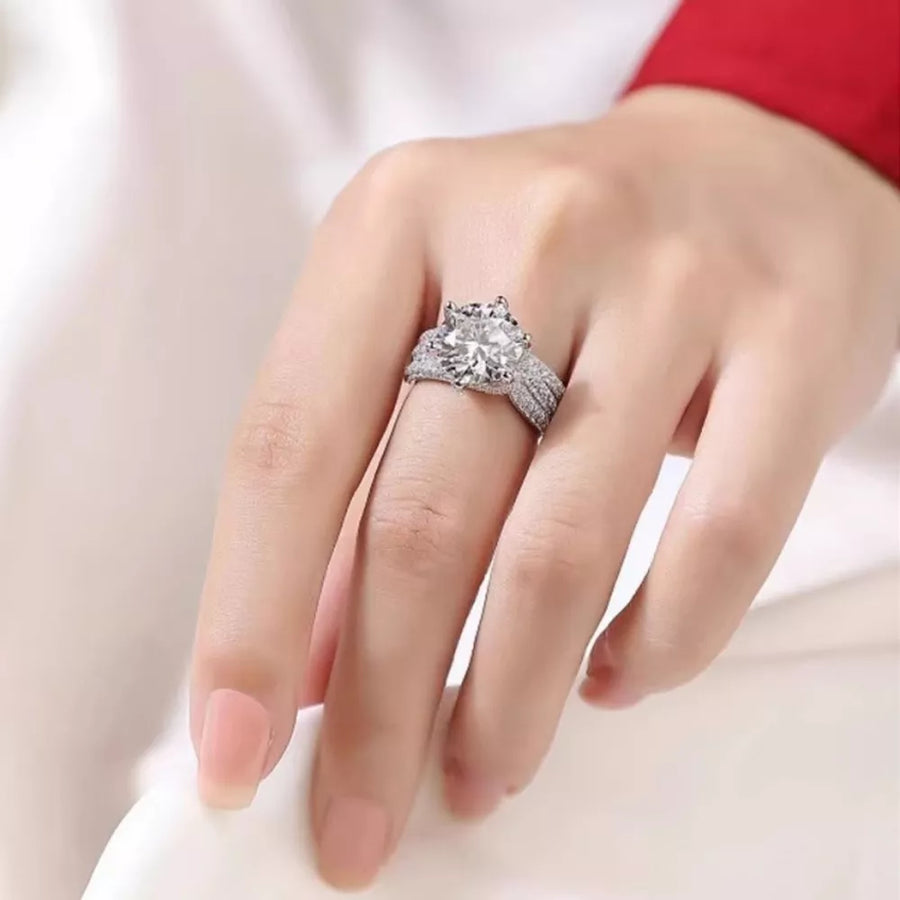 Dazzling moissanite silver ring with certificate, 3 carat brilliant center stone and pave band.