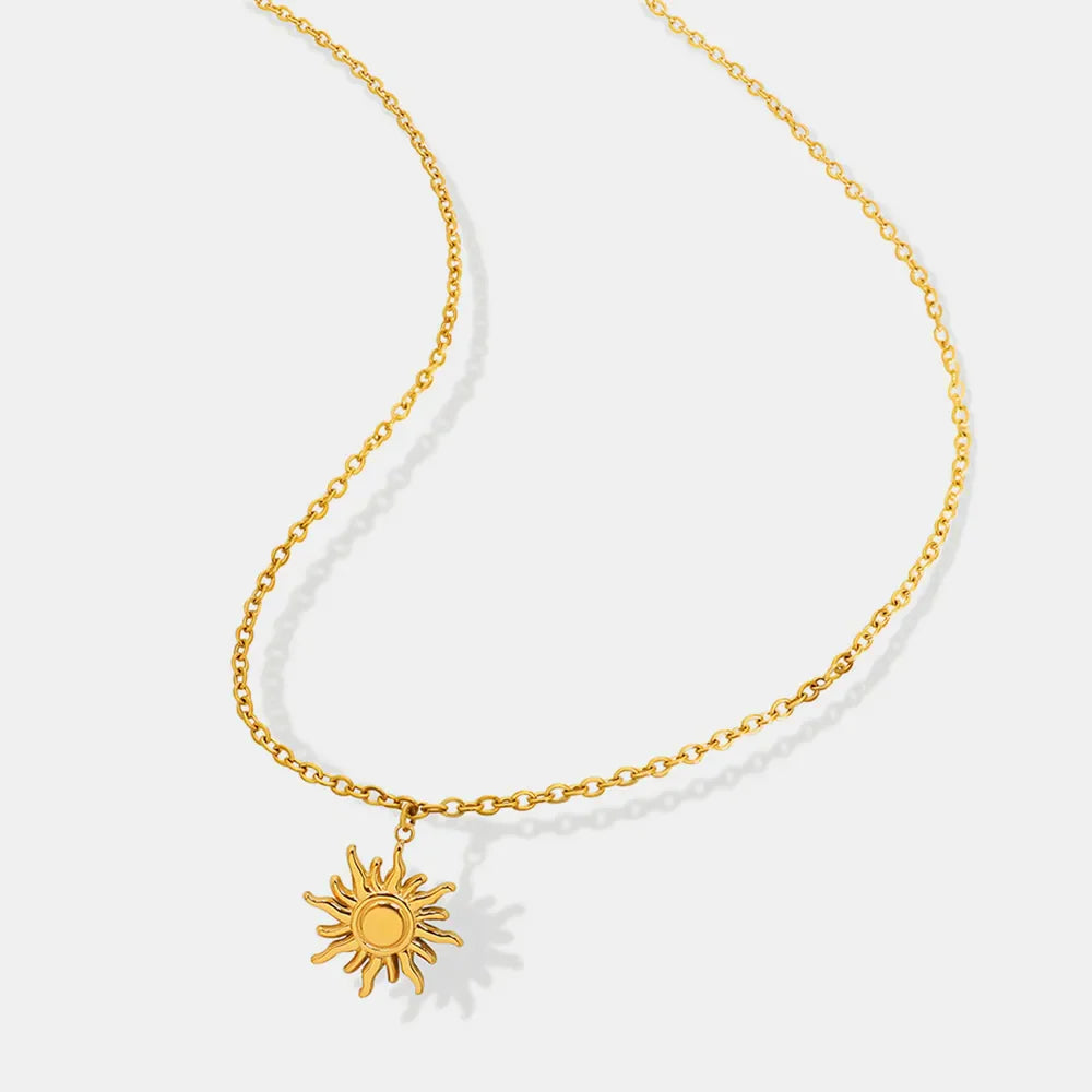 Golden sunburst pendant necklace with adjustable chain, 18K gold-plated.