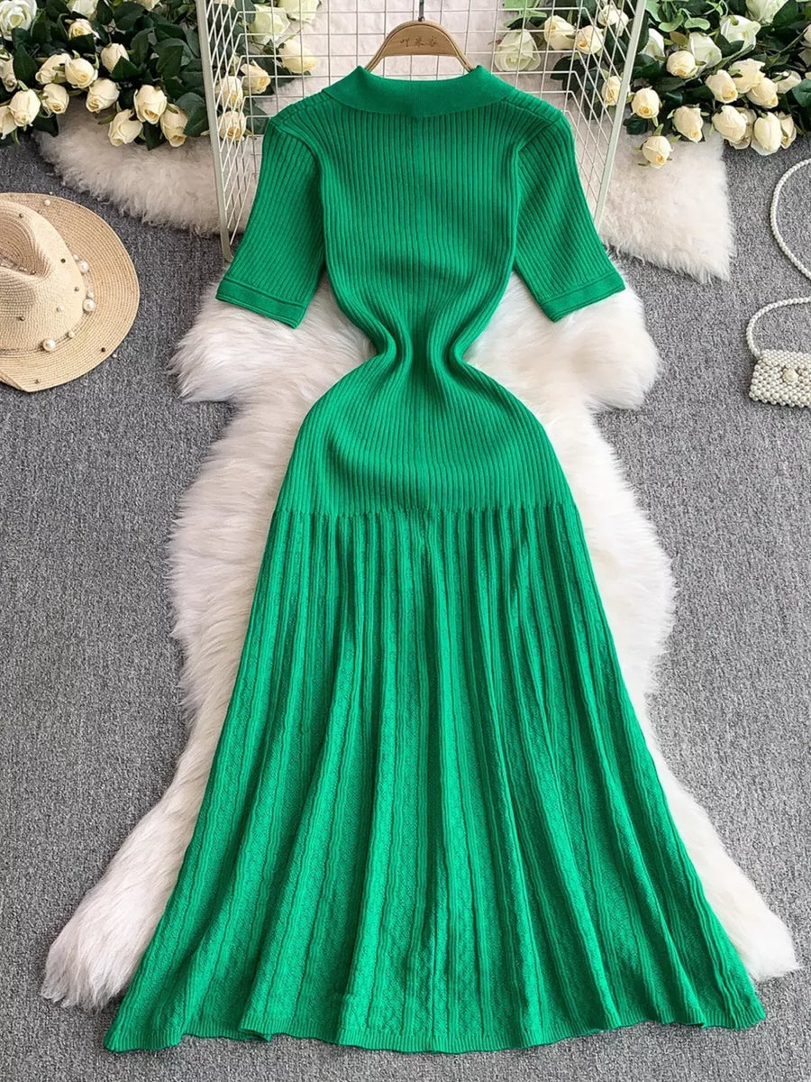Green ribbed knit midi dress with button detail and short sleeves