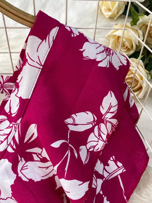 Rose red floral cotton maternity romper cover-up with wide legs and pleated detail.