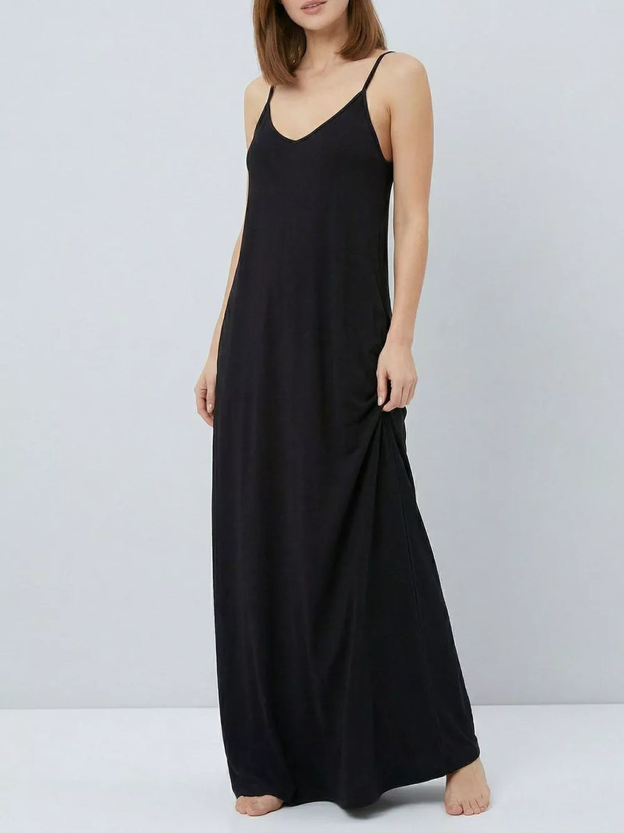 Black maxi dress with V-neck and spaghetti straps, featuring functional pockets.