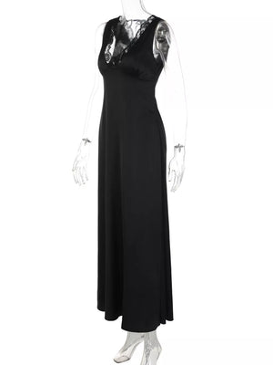 Black sleeveless maxi gown with lace trim neckline and cinched waist.