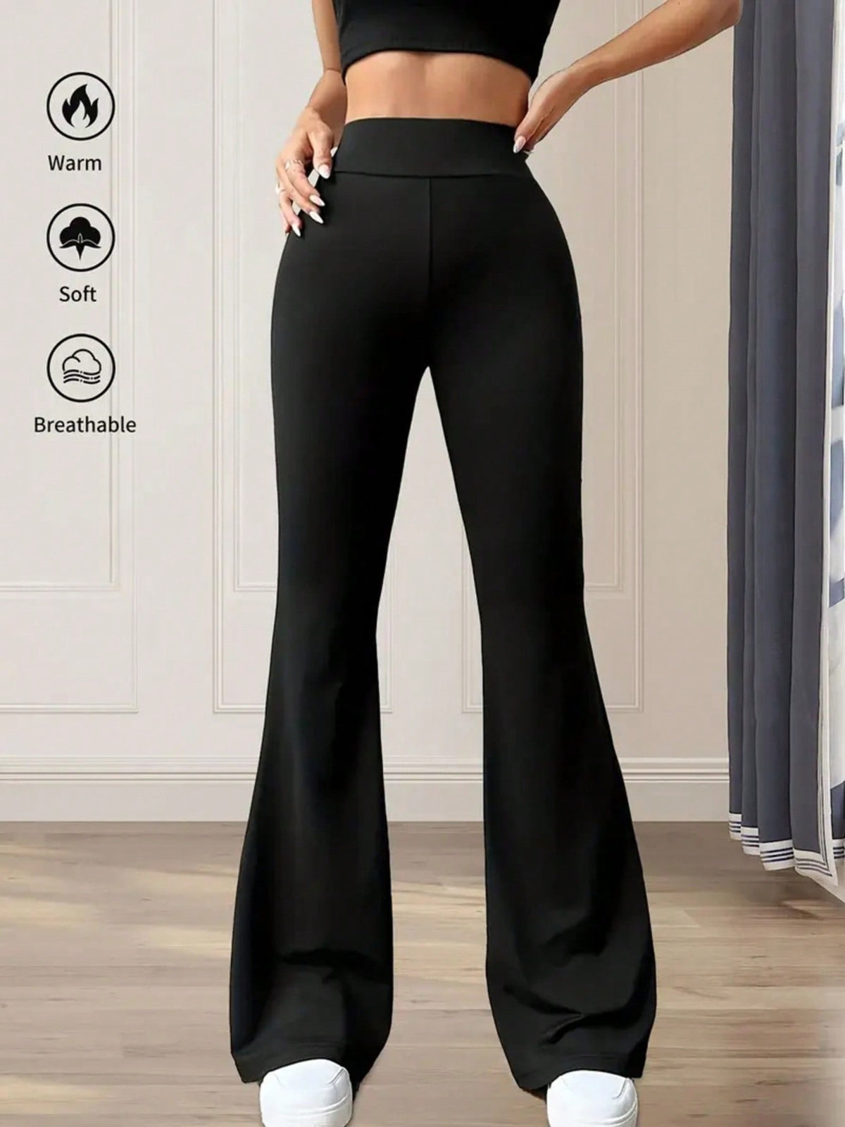 Black high waist flare pants in soft, breathable cotton fabric.