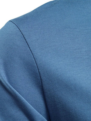 Essential crewneck long sleeve tee in blue fabric with a subtle texture.