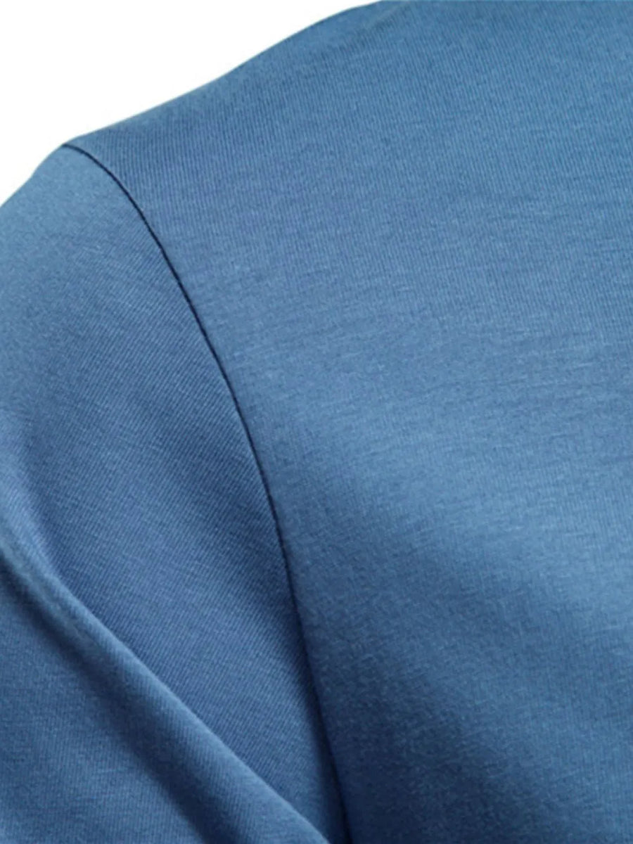Essential crewneck long sleeve tee in blue fabric with a subtle texture.