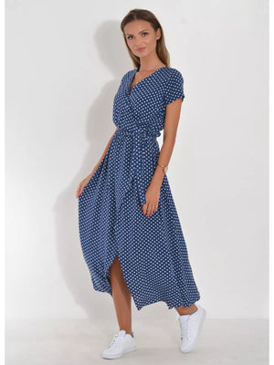 Blue polka dot wrap dress with short sleeves and a midi length skirt with a slit.