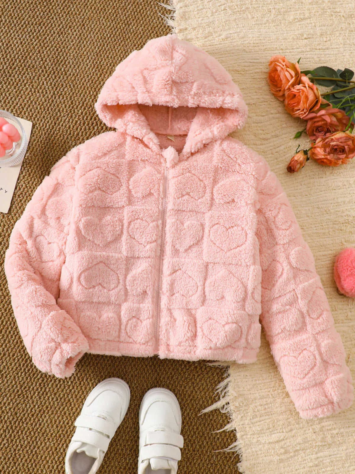 Dusty pink fuzzy heart pattern hooded puffer jacket with zipper closure.