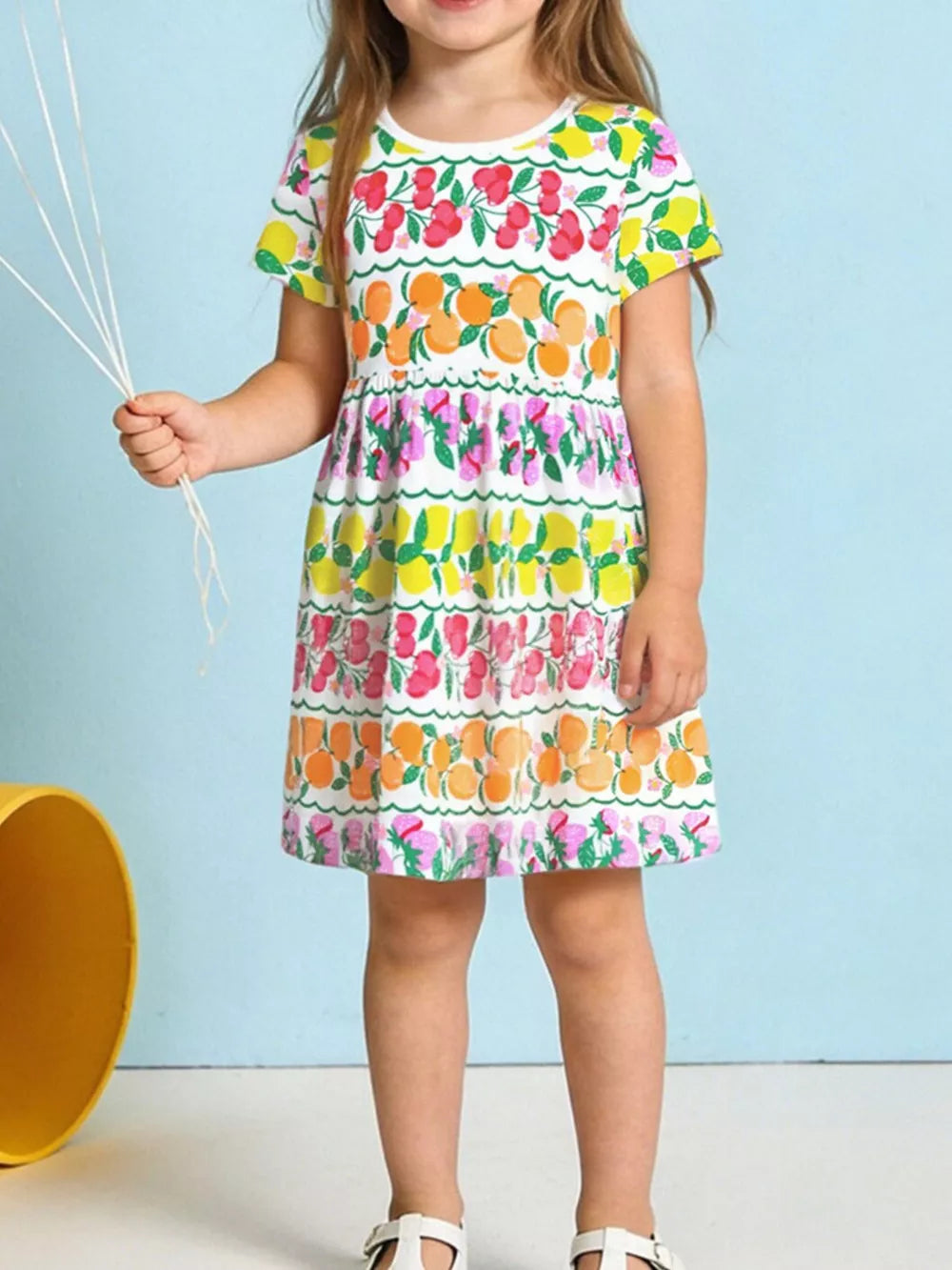 Girls white short sleeve tiered dress with fruit print