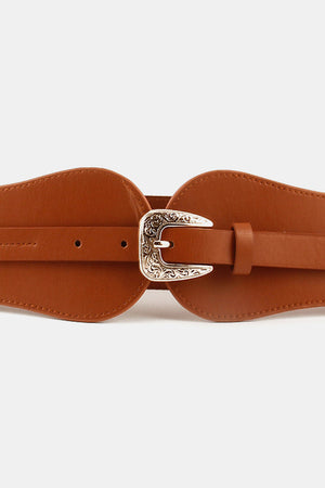 Caramel leather belt with sculpted waistband and ornate silver Western buckle.