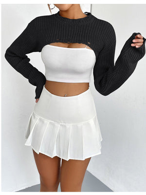 Black distressed knit bolero crop top with long sleeves and distressed neckline detail.