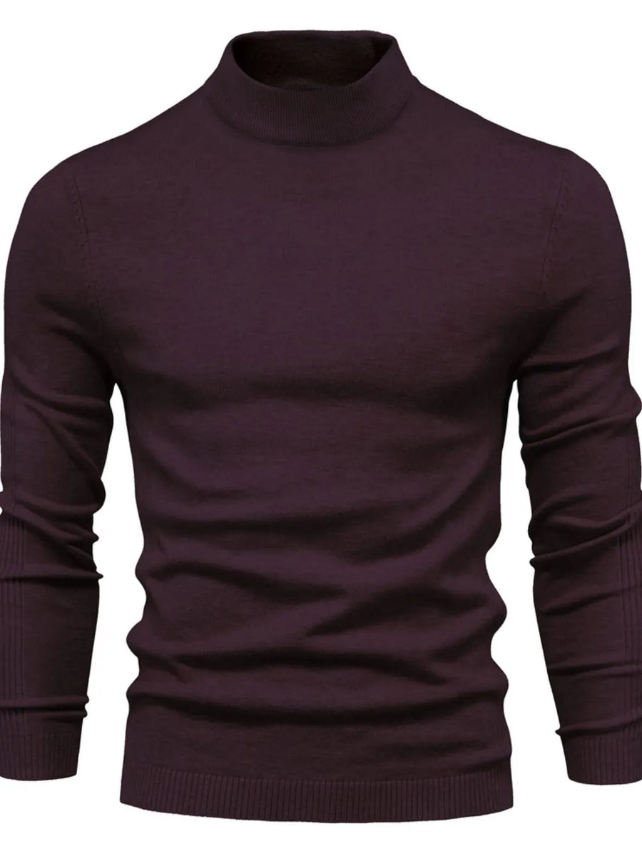 Ribbed mock neck sweater in plum purple with sculpted shoulders and long sleeves.
