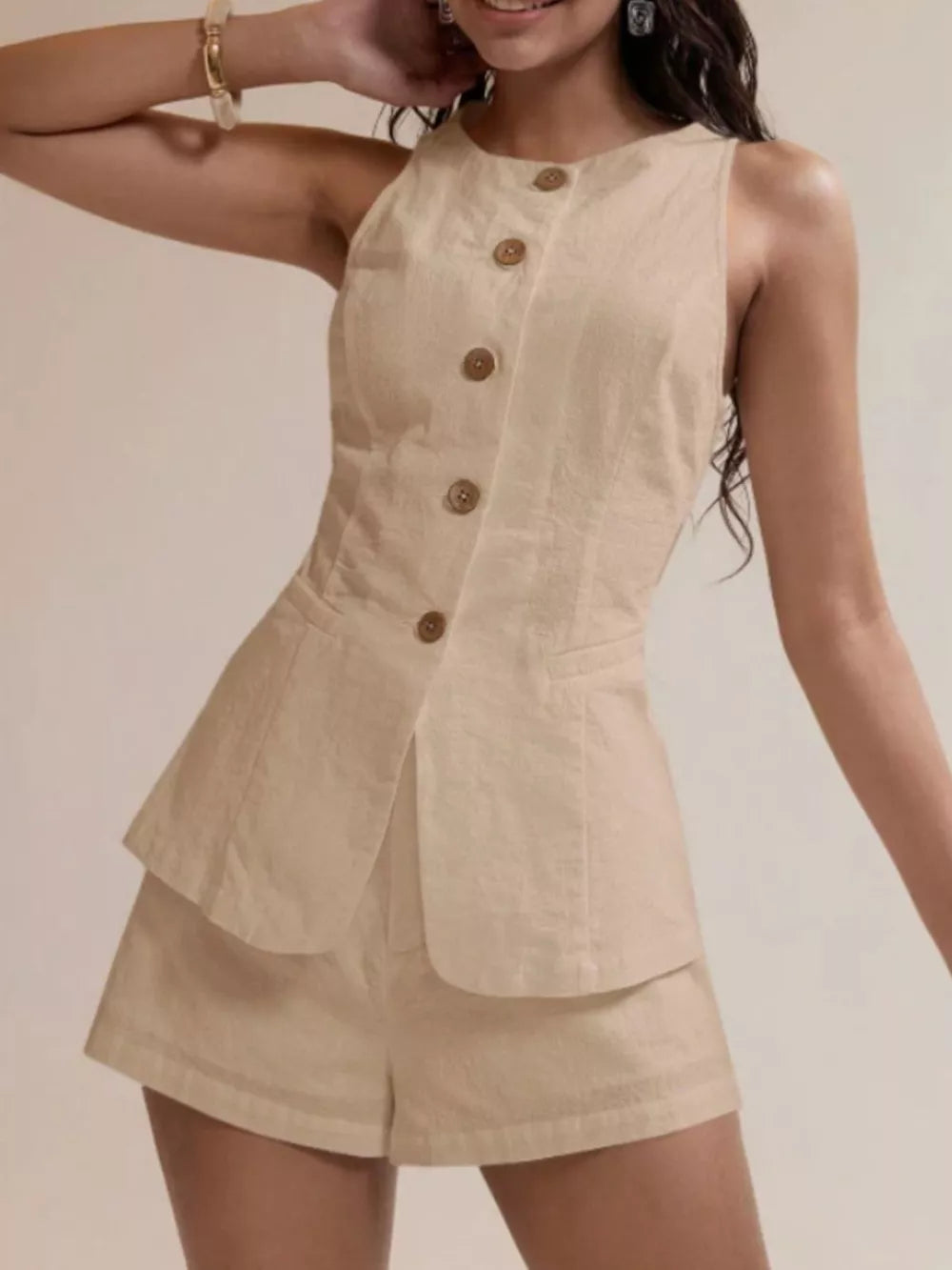 Apricot cotton two-piece set with decorative buttons and shorts.
