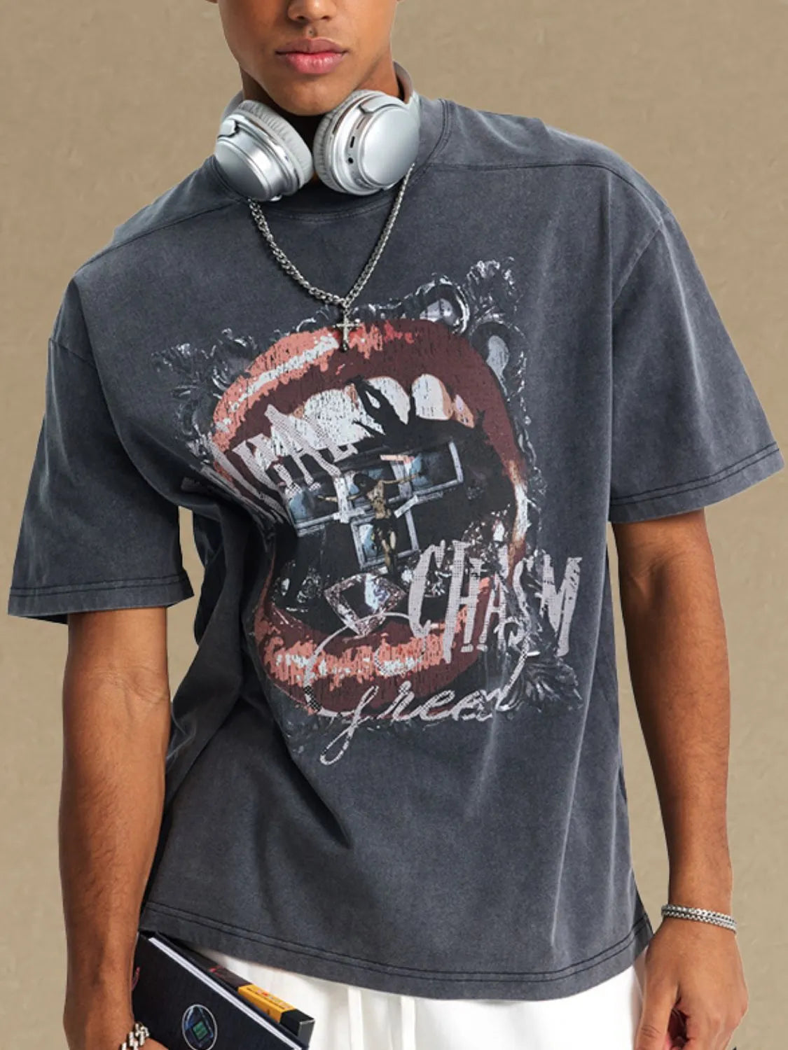 Dark gray washed cotton graphic tee with a bold lip and cross print.