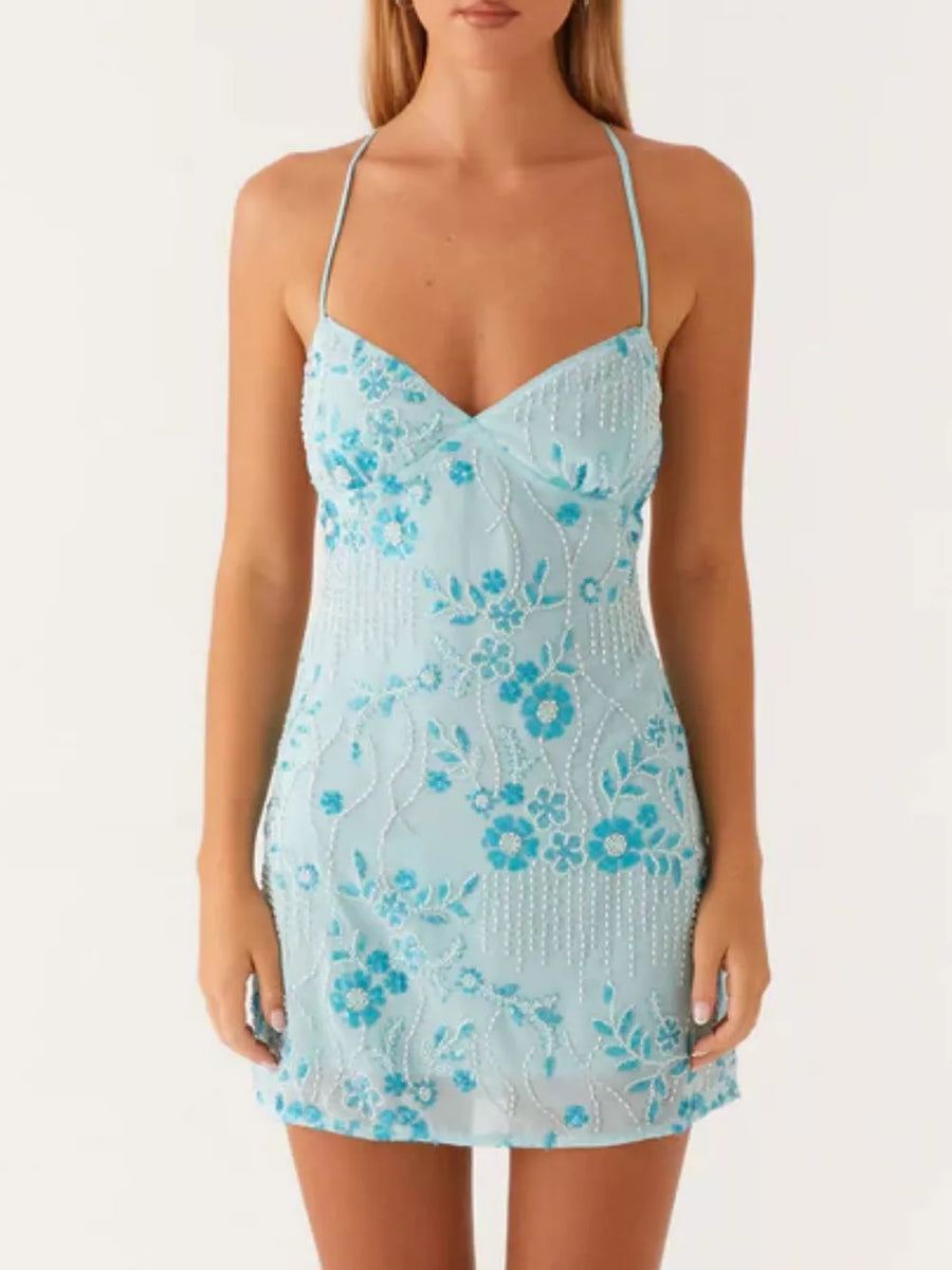Pastel blue mini dress with floral embroidery and beaded fringe detail.