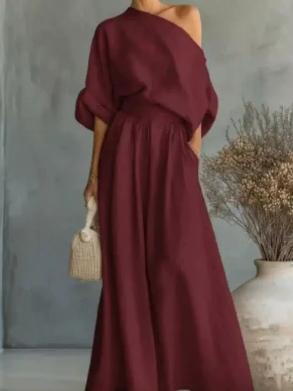 Orange two-piece set with asymmetrical and elbow sleeve