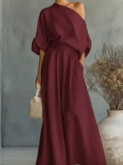 Orange two-piece set with asymmetrical and elbow sleeve