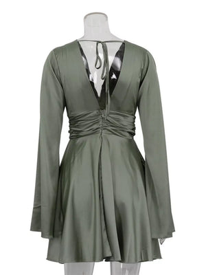 Sage green ruched wrap dress with deep V-neck and tie back, long bell sleeves.