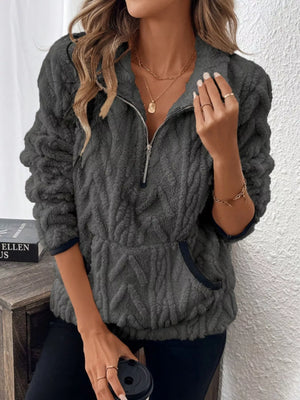 Dark gray sherpa half zip sweatshirt with chevron texture and front pocket