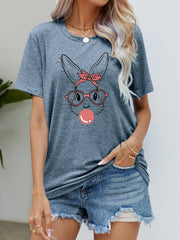 Misty Blue graphic tee with a bunny wearing a bandana and glasses blowing bubblegum.