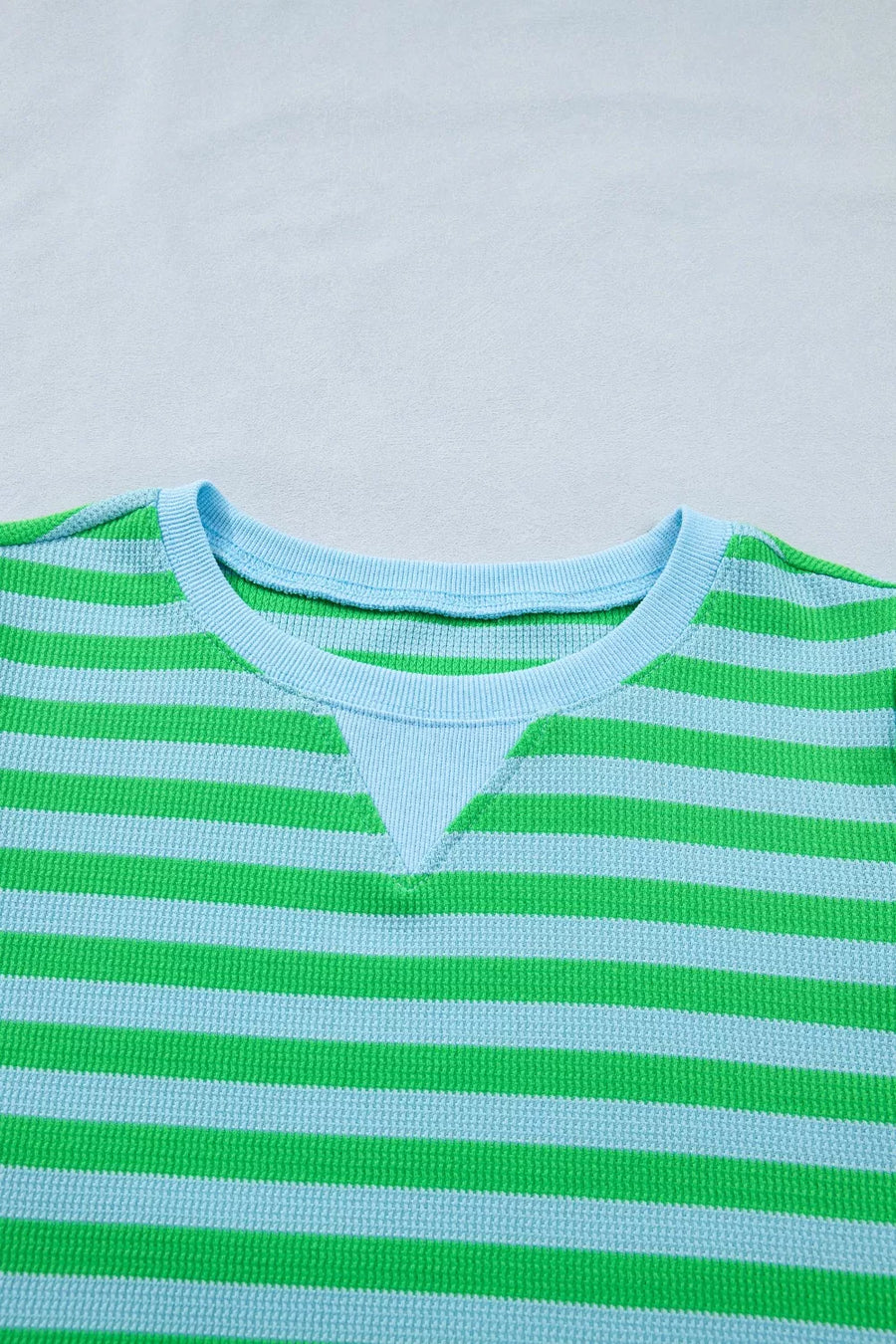 Long sleeve thermal shirt with green and blue stripes and a contrast neckline.
