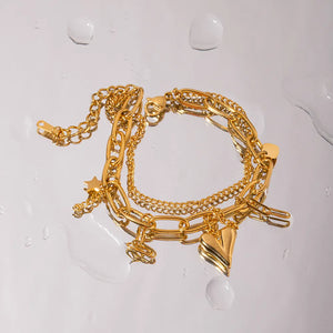 Gold layered chain bracelet with star and heart charms
