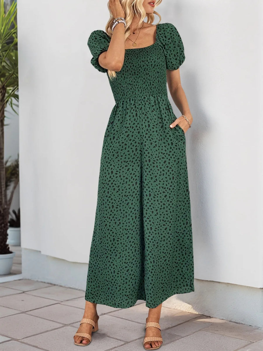 Dark Green leopard print smocked bodice jumpsuit with puff sleeves and wide legs.