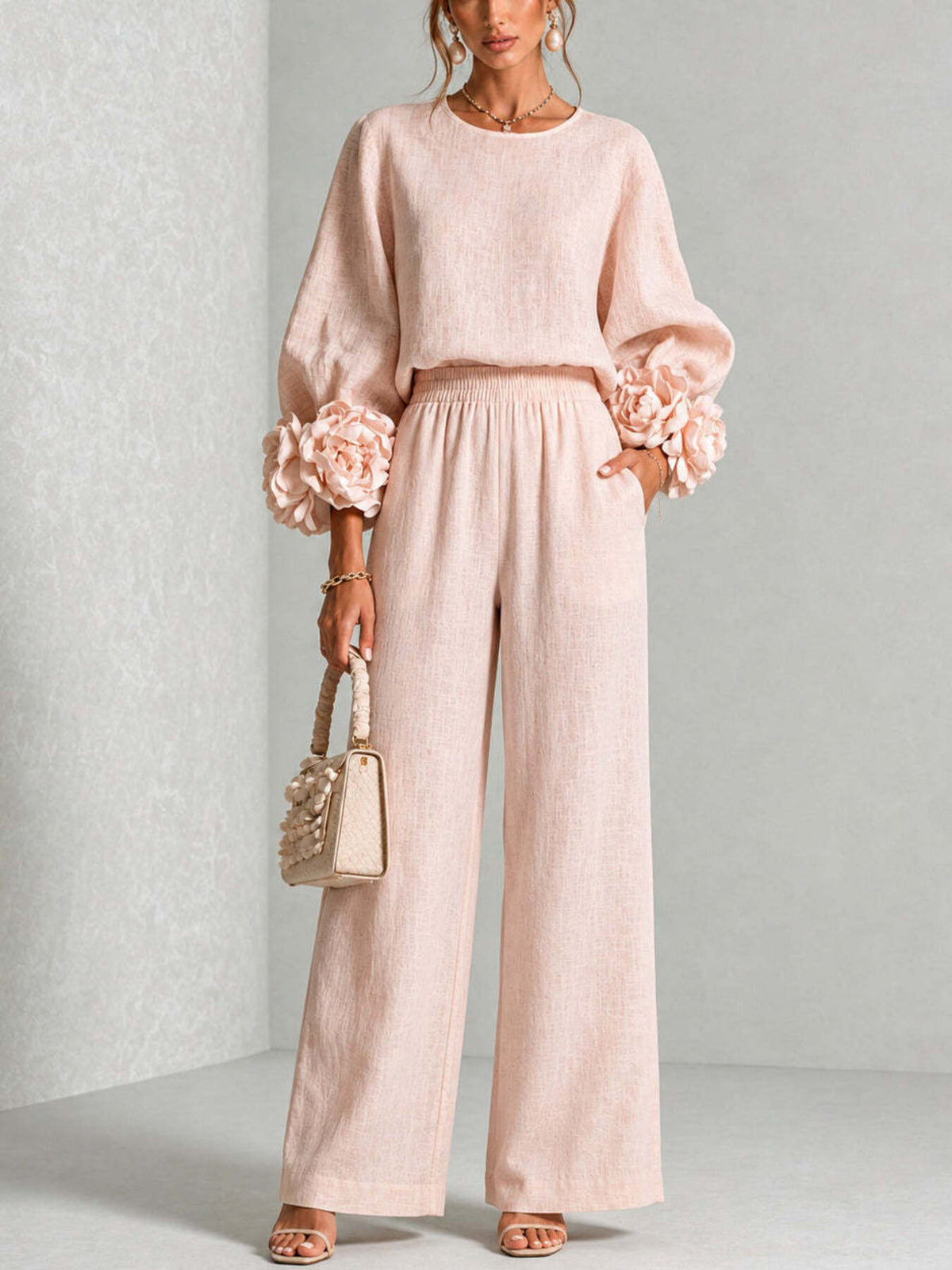 two-piece set in blush pink featuring pocketed and relaxed (top), wide-leg (pants) fit