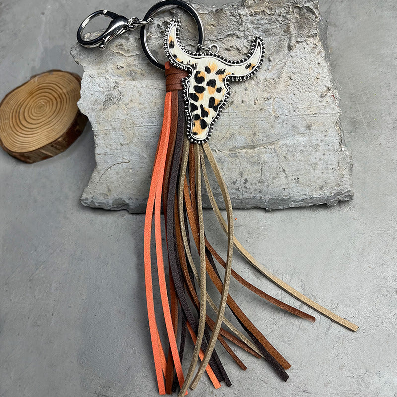 Cowhide horn keyring with leopard print detail and multi-color fringe tassels.