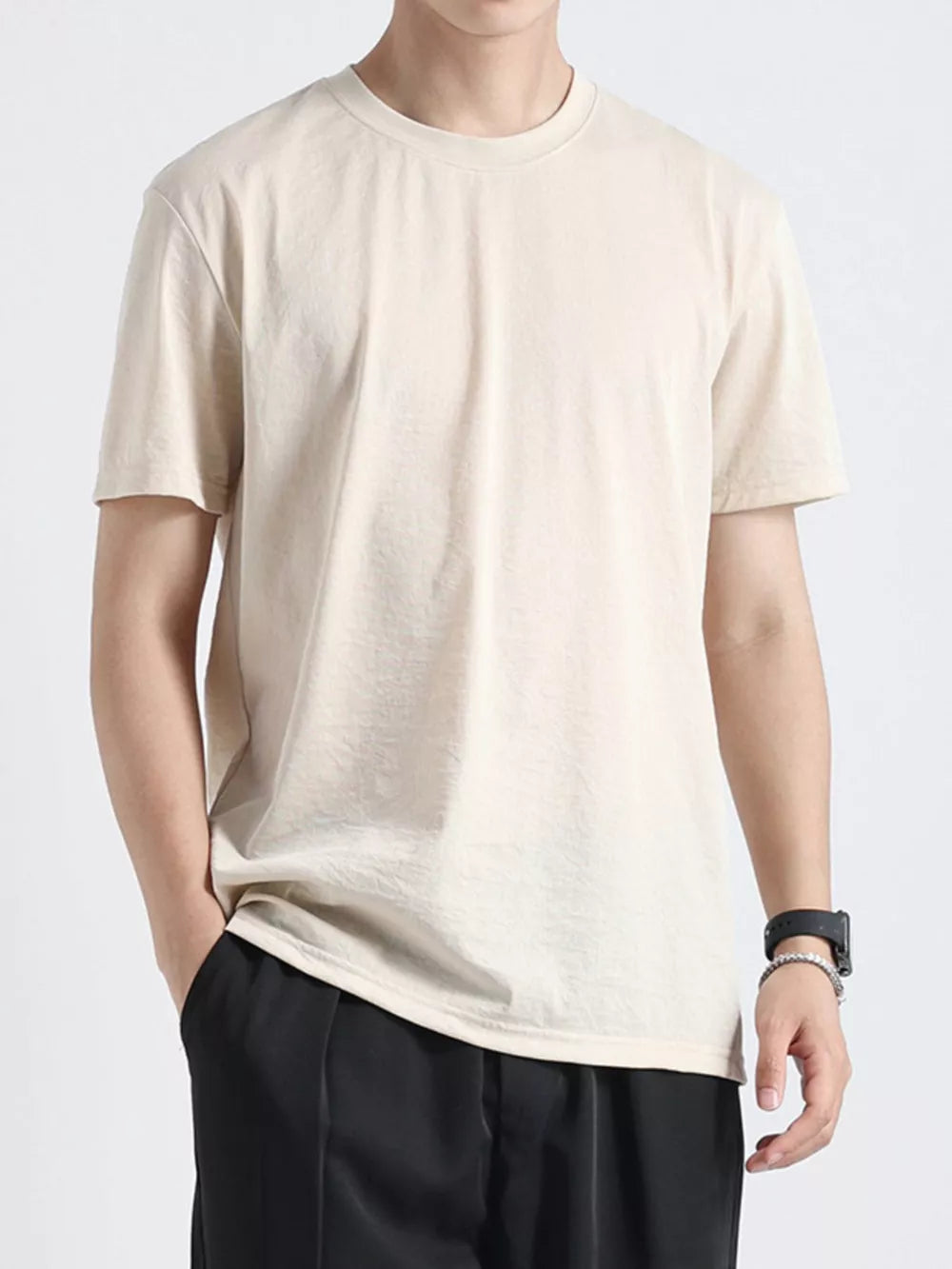 Relaxed fit men's apricot cotton t-shirt with crew neck and short sleeves.