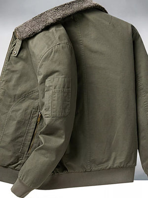 Men's military green bomber jacket with plush sherpa collar and zippered pocket detail.