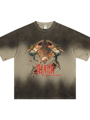 Distressed khaki t-shirt with a bold shark graphic and distressed details.