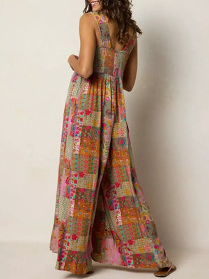 Vibrant patchwork wide-leg romper with smocked bodice and square neckline.