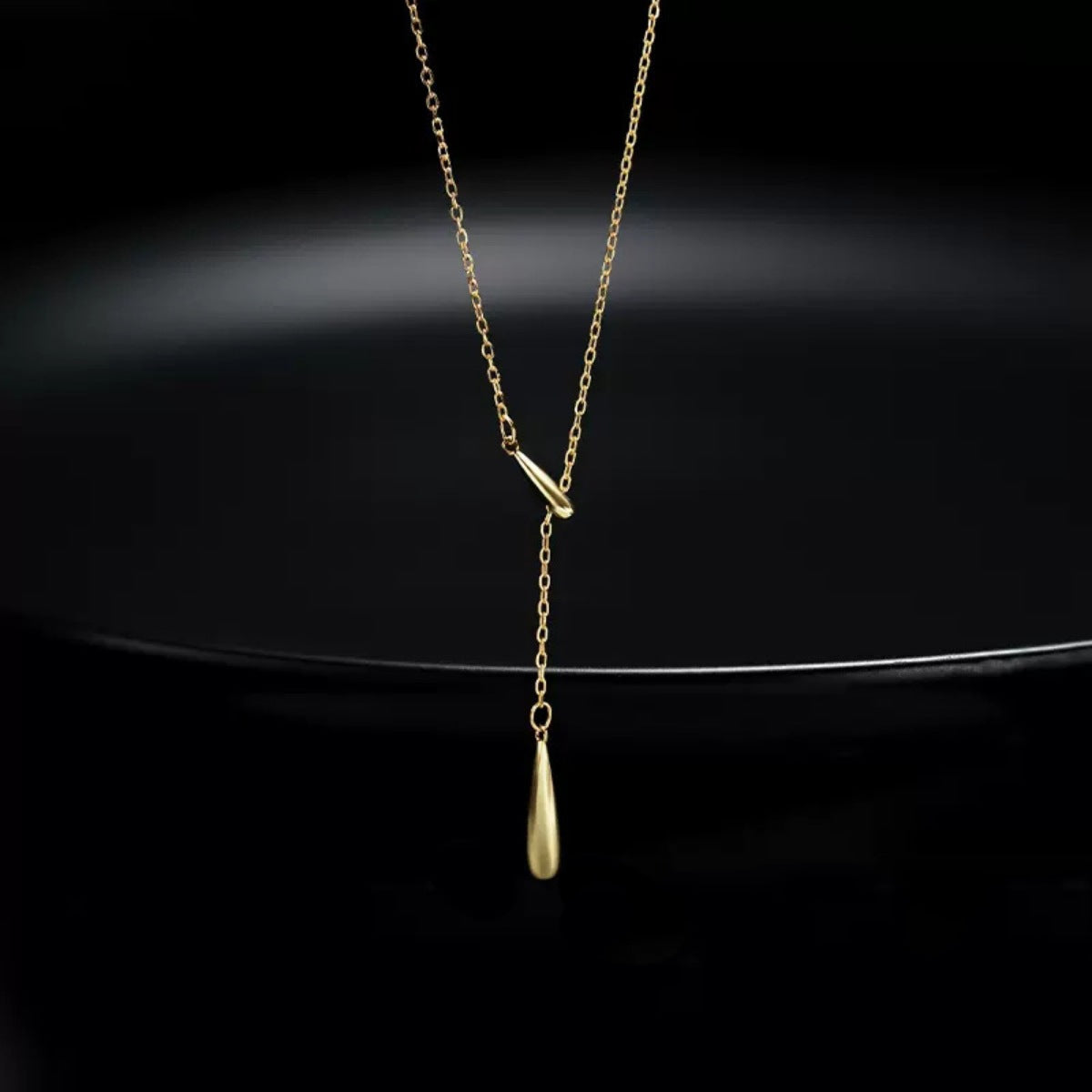 Gold Y-shaped pendant necklace with a teardrop charm, 18k gold-plated.