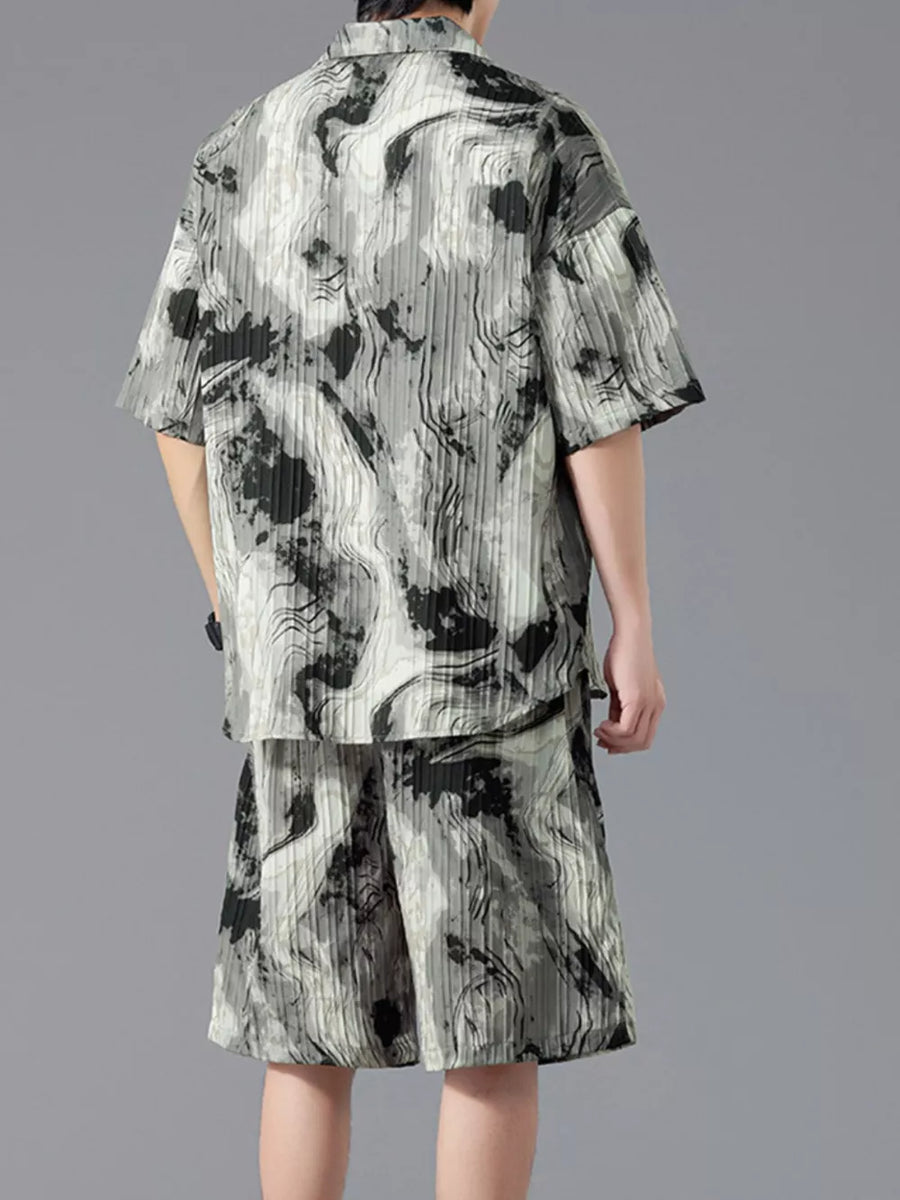 Men's casual set with tie-dye pattern, short sleeves, and shorts.
