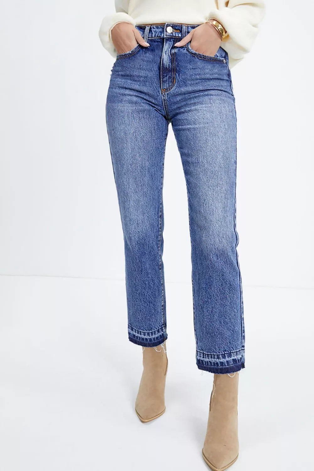 Blue cotton blend cropped jeans with raw hem detail