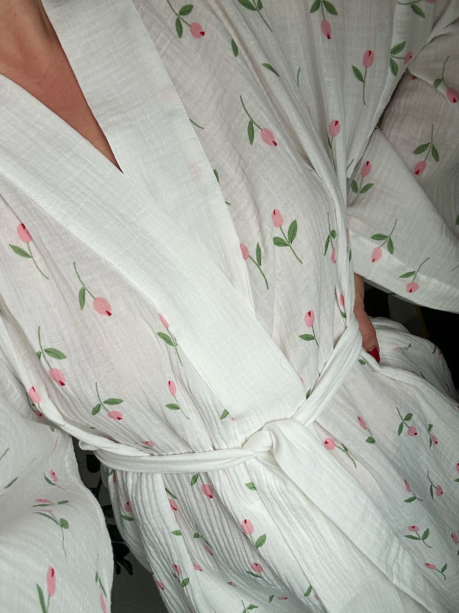 White cotton robe with pink floral print, tie waist, and V-neck