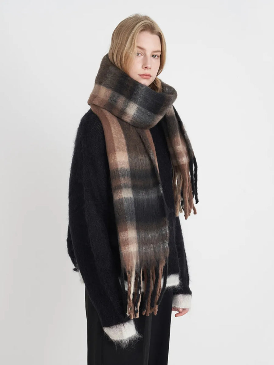Textured plaid fringe wrap scarf in brown/black/white with fringed edges.