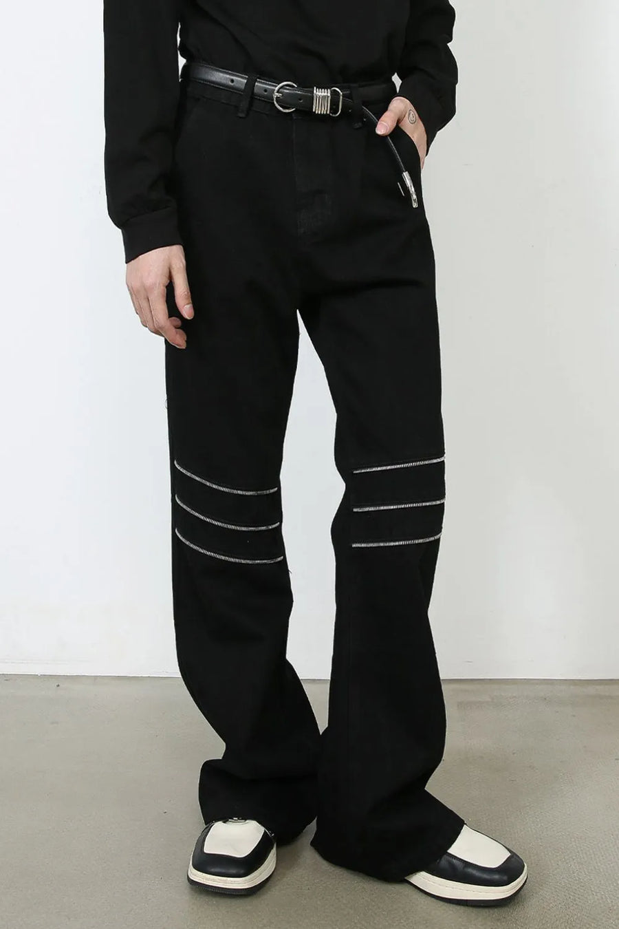 Black bootcut jeans with zipped knee detail