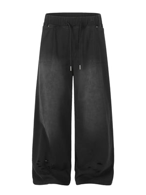 Black distressed wide-leg drawstring sweatpants with ripped details