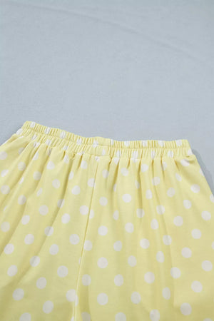 Pastel yellow polka dot polyester shorts with elastic waistband