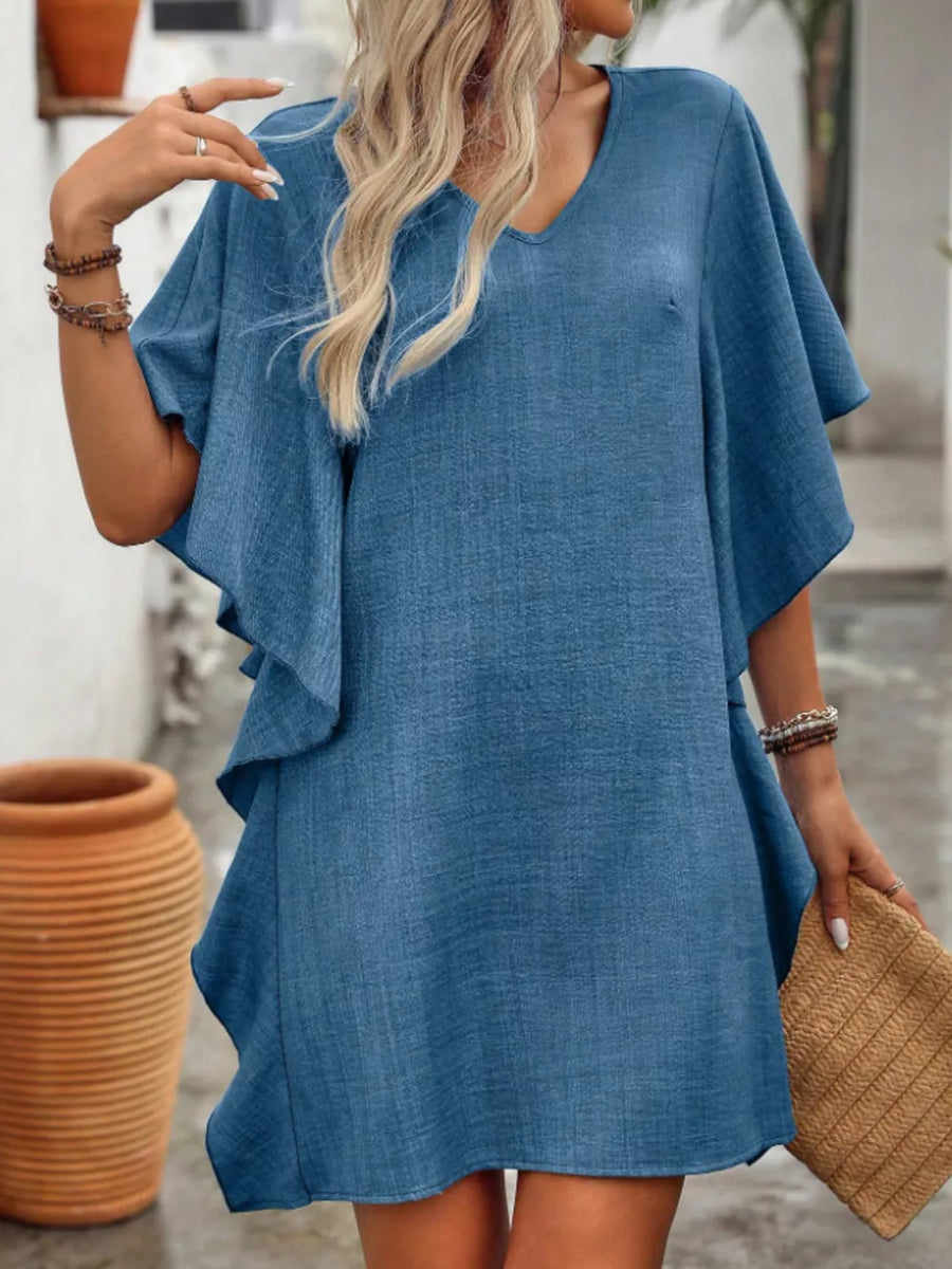 Blue V-neck mini dress with flowy sleeves and textured fabric.